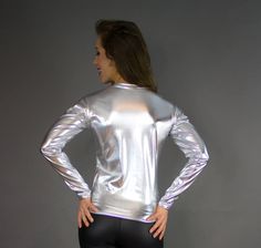 This custom made long sleeve shirt is available in every fabric we offer and can be ordered in a standard size or made custom to your measurements. SHOWN IN OUR SPECIAL SILVER METALLIC FOIL! For custom sizing, we would need the following measurements messaged to us: Neck Chest Waist Hip Bone Shirt Length (shoulder to hemline) Bicep Forearm Wrist View our measurement guide here: http://misterpierrefashion.com/sizing Mister Pierre Fashion has over 30 years experience custom making garments. Hand m Metallic Fitted Long Sleeve Tops, Metallic Fitted Crew Neck Top, Metallic Long Sleeve Tops For Fall, Stretch Long Sleeve Shirt, Hip Bone, Club Wear, Metallic Foil, Custom Tailoring, Orlando Fl