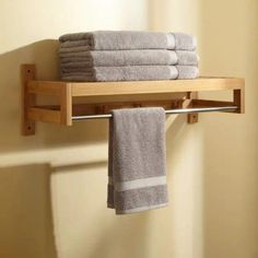 towels are hanging on a towel rack in the bathroom