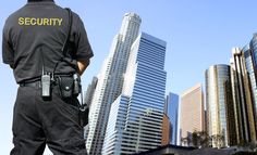 a police officer standing in front of tall buildings