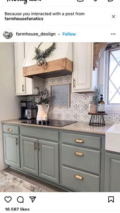 a kitchen with white cabinets and gray counter tops, gold pulls on the cabinet doors