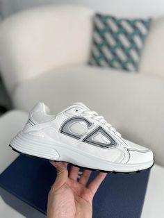 Embrace a sleek and sporty aesthetic with these Dior B30-inspired sneakers in a pristine white colorway. Crafted with breathable mesh and technical fabric, these shoes are perfect for those who value style and performance. The lightweight construction and sculpted rubber sole ensure all-day comfort and support, while the signature "CD30" logo adds a touch of Dior's iconic style. Whether you're hitting the gym or the streets, these sneakers will elevate your look with a touch of understated luxur White Sneakers With Reflective Details For Light Sports, White Sneakers With Reflective Details For Sports, White Reflective Sneakers For Sports, White Athleisure Sneakers With Reflective Details, White Technical Mesh Sneakers, White Sneakers With Reflective Details For Jogging, White Mesh Running Shoes With Abzorb Midsole, White Breathable Sneakers, Medium Fit, White Breathable Sneakers Medium Fit