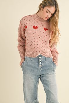 Pink long sleeve knit sweater with red heart details. Model is wearing a small. Height - 5' 9" / 179.8CM Denim Pants Romper, Love Sweater, Zippered Sweater, Long Sleeve Knit Sweaters, Jumpsuit Shorts Rompers, Pink Long Sleeve, Pattern Sweater, Heart Pattern, Denim Flares