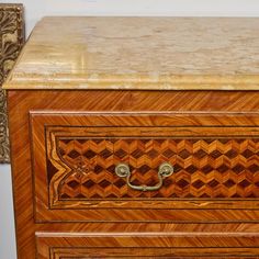 A matched pair of veneered, fruitwood and walnut marquetry commodes with Sienna marble tops.  Bronze mounts with traces of gilding. Marquetry, Marble Top, Walnut, Marble