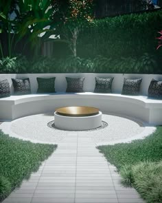 a circular seating area with pillows on it