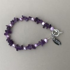 "This beautiful Amethyst & Freshwater Pearl Bracelet is designed and made in Ireland. The toggle clasp is pewter. The bracelet is 8\" in length, is made on wire and has a toggle clasp. The bracelet can be made longer or shorter. There are also matching necklace options." Adjustable Amethyst Jewelry With Lobster Clasp, Adjustable Nickel-free Amethyst Bracelets, Adjustable Nickel-free Purple Charm Bracelet, Adjustable Purple Beaded Bracelets With Lobster Clasp, Purple Pearl Bracelet As Gift, Adjustable Purple Metal Crystal Bracelet, Adjustable Purple Metal Charm Bracelet, Adjustable Purple Pearl Bracelet Gift, Adjustable Purple Pearl Bracelet As Gift