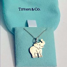 Tiffany & Co. Sterling Silver Elephant Charm Pendant Necklace Length: 18 Inches Length Includes: Box And Pouch Personalized: On The Back Of The Necklace: Ily (Meaning= I Love You) Want To Give Your Loved One A Good Luck Charm & A Sweet Sentimental Note? This Is The Perfect Gift! Designer Engraved Necklace For Gift, Designer Sterling Silver Necklace Gift, Designer Sterling Silver Necklace For Gift, Designer White Necklaces For Gifts, Elegant Tan Jewelry For Formal Occasions, Elegant Tan Jewelry For Gift, Elegant Tan Necklace For Gift, Elegant Tan Necklaces For Gifts, Elegant Sterling Silver Tan Necklace