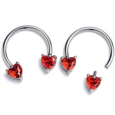 three heart shaped navel rings with red crystals