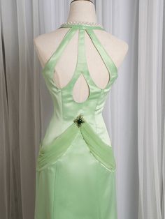 tep into a world of timeless elegance with our Light Green Cutout Back V-neck Vintage Mermaid Skirt Gown. This enchanting gown features a soft, light green hue that exudes a fresh and delicate charm. The V-neckline accentuates your décolletage, adding a touch of sophistication to the overall look. ​The gown boasts a mermaid silhouette, hugging your curves and flaring out gracefully at the hem, creating a stunning, vintage-inspired shape. The cutout back design adds a modern twist, ensuring you m Fitted Green Evening Dress For Pageant, Embellished Fitted Green Mermaid Dress, Green Fitted Gown For Pageant, Elegant Mermaid Dress With Sweep Train For Pageants, Elegant Mermaid Dress With Sweep Train For Pageant, Elegant Green Gown For Pageants, Elegant Green Gown For Pageant, Elegant Mermaid Hem Pageant Dress, Elegant Mermaid Dress For Pageant With Fitted Bodice