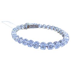 The Following Item we are offering is this Beautiful Rare Important 18KT White Gold Large Glittering Round Diamond Tennis Bracelet. Bracelet is comprised of over 25CTS Magnificent Rare Gorgeous Fancy Glittering Round Diamonds!!! The Diamonds are of Beautiful Fine Quality. This Magnificent Bracelet is a Rare Sample Piece From a Private Manufacturer that sold to select Five Star Hotel and Fine Jewelry Stores. Original Retail $205,000 and Comes with a Certificate from the Gemological Appraisal Laboratory of America!!! Bracelet Tennis, Modern Bracelets, Diamond Tennis Bracelet, Five Star Hotel, Tennis Bracelet Diamond, Tennis Bracelet, Five Star, Modern Jewelry, Arm Band