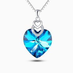 An explosion of beautiful colors, our Heart of the Ocean is crafted in 925 Sterling Silver that features a gorgeously crafted heart stone pendant. Exclusively available in silver. This bright sparkling necklace adds some “wow factor” to your wardrobe! Premium Materials - Made from authentic gemstones & nickel-free metal Blue Jewelry With Heart Charm For Gifting, Blue Heart Charm Jewelry As Gift, Blue Heart Charm Jewelry As A Gift, Blue Heart Charm Jewelry For Gift, Blue Heart Charm Jewelry Gift, Cubic Zirconia Gemstone Heart Pendant Necklace, Valentine's Day Crystal Pendant Necklace, Crystal Heart Pendant Jewelry For Her, Crystal Heart Cut Jewelry With Heart Charm