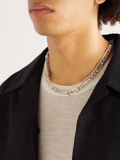 MAOR's 'Unity' collection explores innovative ways of using intertwined links, celebrating the beauty of human connection. This necklace is crafted with a directional silver chain that's polished for a high-shine finish. It's fitted with a hidden lock mechanism that allows it to be worn in any direction without the fastening showing. Modern Sterling Silver Necklace For Formal Occasions, Modern Sterling Silver Necklace For Formal Events, Modern Polished Chain Necklace As Gift, Modern Polished Chain Necklace For Gift, Elegant Silver Chain Necklace With Polished Finish, Minimalist Link Necklace With Polished Finish, Formal Sterling Silver Cable Chain Jewelry, Formal Metal Necklace With Polished Finish, Polished Finish Link Jewelry For Gifts