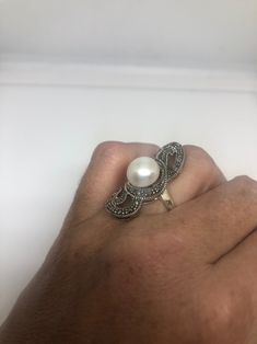 Vintage hand made Genuine Pearl set in 925 Sterling Silver with Marcasite ring Size 7 Can be re sized for you. My jeweler charges about $10-$15 All rings are shipped in a nice gift box. Check out our over a THOUSAND great reviews Engraving is $4 per letter and is not always perfect depending on the piece. It can take a few days if the jeweler is busy. This is payable to Paypal Judithsltd@gmail.com Heirloom Silver Oval Pearl Ring, Hallmarked Sterling Silver Oval Pearl Ring, Hallmarked Oval Pearl Ring In Sterling Silver, Oval Sterling Silver Hallmarked Pearl Ring, White Sterling Silver Art Deco Jewelry, Vintage Oval Sterling Silver Pearl Ring, Vintage Oval Pearl Ring In Sterling Silver, Handmade Vintage Pearl Ring In Sterling Silver, Handmade Vintage Sterling Silver Pearl Ring