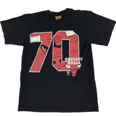 Vintage 90s Chicago Bulls NBA T-shirt. Made in the USA. Nutmeg. Large from graphic Measures as a small. 19 inches pit to pit, 27 inches long. No rips, tears, or stains. Slightly faded. Smoke and pet. Free home. Vintage NBA. 70 wins. Chicago Bulls. 90s. USA made. Black Short Sleeve T-shirt For Basketball, Retro Sports T-shirt With Graphic Print, Casual Basketball T-shirt With Screen Print, Vintage Graphic Print T-shirt For Sports Events, Throwback Crew Neck Fan Merchandise Tops, Throwback Cotton Fan Merchandise Tops, Black Short Sleeve Throwback T-shirt, Throwback Cotton Tops For Fan Merchandise, Throwback Black Short Sleeve Top