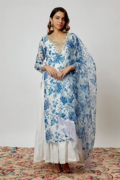 Blue and white chanderi kurta with floral print and sequins embroidered neckline. Comes with pant, a crushed cotton inner anarkali and an organza dupatta with fringed hem. - Aza Fashions Blue Chikankari Embroidery Palazzo Set For Reception, Blue Palazzo Set With Chikankari Embroidery For Reception, Blue Kurta With Sheer Dupatta For Reception, Bohemian Blue Sharara With Cutdana, Blue Bohemian Sharara For Reception, Blue Bohemian Palazzo Set With Zari Work, Blue Bohemian Chanderi Palazzo Set, Blue Bohemian Anarkali Set With Pallu, Bohemian Blue Anarkali Set With Pallu