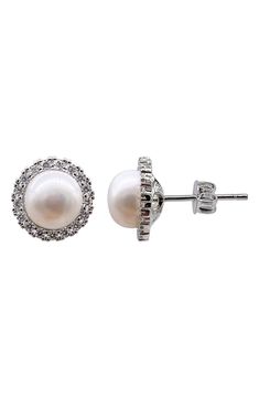 Freshwater pearls and glistening Swarovski crystals add a shimmering effect to a pair of stud earrings for a timeless, elegant appearance. 12mm length 9mm pearl Post back White rhodium plate or 14k-gold plate/Swarovski crystal/freshwater pearl
 Made in the USA Crystals Earrings, Halo Stud Earrings, Halo Earrings Studs, Swarovski Crystal Earrings, Jewelry Earrings Studs, Rhodium Plated, Swarovski Crystal, Freshwater Pearls, Swarovski Crystals