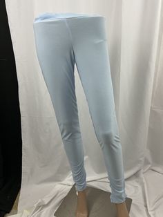 the mannequin is wearing blue pants and white shoes