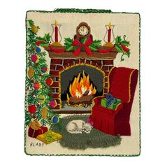 a christmas scene with a fireplace, chair and cat on the rug in front of it