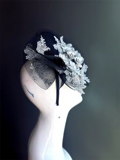 Black Tulle with silver Floral combination evokes a sense of elegant and dark floral beauty. Perfect for weddings, cocktail parties, or any elegant event, the Twilight Blossom Fascinator adds a touch of refined beauty and modern style to your ensemble. Age Group/Gender - Adult/Women Size/Type - One size fits all adults Color - White Material - Tulle/Lace Special Features - Fascinator with clip/headband options Personalization - Not available Black Mini Hat For Wedding At Royal Ascot, Fitted Bridal Accessories For Royal Ascot Party, Elegant Fitted Wedding Headpieces, Elegant Black Fascinator For Events, Elegant Black Fascinator For Evening, Elegant Black Headpiece For Kentucky Derby, Elegant Black Headpiece For Party, Elegant Black Evening Headpieces, Fitted Bridal Accessories For Kentucky Derby Party