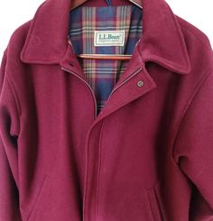 Vintage L. L. Bean jacket.  Burgandy coat lined with a plaid fabric.  Bomber style jacket is in good condition on the outside bur has a couple worn spots in the lining.  No size tag. Measures 25" from armpit to armpit. Coat Vintage, Plaid Fabric, Colorado Springs, Men's Coats And Jackets, Vintage Jacket, L L Bean, Wool Coat, Size Tag, Mens Coats