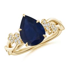 a yellow gold ring with an oval blue sapphire and diamonds