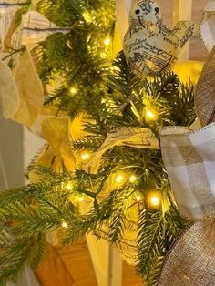 a christmas tree decorated with burlocks and lights in the shape of an ornament