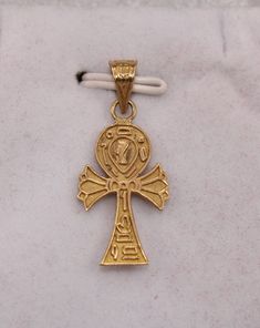 "Egyptian Handmade Ankh Cross Key of Life + Nefertiti 18K Yellow Gold Pendant 1.7Gr Weight Approximate :1.7 Gr Height : 1.1\" = 31 mm Width : 0.5\" = 13 mm ✔ IT IS Tested & SIGNED WITH THE EGYPTIAN Gold Government HALLMARK FOR 18K GOLD to Ensure Authenticity. ✔ Lovely gift idea ABSOLUTELY GORGEOUS, LOOKS FABULOUS ON. ✔ 100% Egyptian handmade. ✔ Condition: A brand-new, exactly as on the photos. ★ GIFTS ✔ All items are packaged in a paper jewelry gift box, ready for gifting. ✔ If you are sendi Gold Symbolic Crucifix Jewelry And Charms, Antique Ankh Jewelry As Gift, Antique Gold Ankh Jewelry, Antique Ankh Jewelry Gift, Antique Ankh Shaped Jewelry Gift, Key Of Life Egyptian, Egyptian Gold, Egyptian Revival Jewelry, Key Of Life