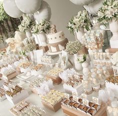 a table filled with lots of different types of desserts