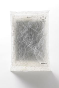 a bag of white marble sitting on top of a table