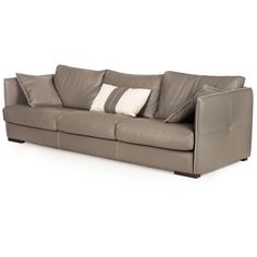 a gray leather couch with two pillows on it's back and one arm facing the camera