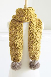 a knitted scarf on top of a mannequin