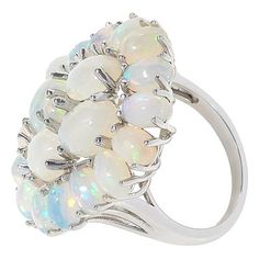 Colleen Lopez White Opal Cluster Ring  Discover what makes opal so special with this ethereal statement ring. It features a cluster design of round and oval-shaped white opals set atop a delicate sterling silver band.        Approx. 1-3/16"L x 15/16"W x 7/16"H; shank 1/16"W     Stamped .925 sterling silver; rhodium plating   Stone Information       All sizes and weights approximate     White Opal - Round (3.5mm), oval (6x4mm, 8x6mm) White Multi-stone Moonstone Ring Fine Jewelry, White Cabochon Opal Ring, White Oval Cabochon Opal Ring, Oval Cabochon Opal Multi-stone Jewelry, White Ethiopian Opal Ring For Anniversary, White Ethiopian Opal Jewelry For Anniversary, White Oval Opal Ring Fine Jewelry, White Opal Oval Cabochon Ring, White Opal Oval Cabochon Ring For Anniversary