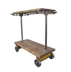 a wooden and metal cart with wheels