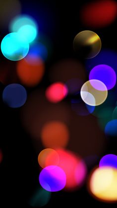 blurry image of colorful lights in the dark