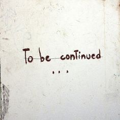 graffiti written on the side of a white wall that says to be confined in red ink