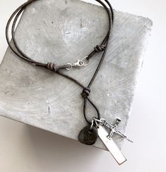 "Artisan Collection of Pendants...Great Father's Day Gift or gift for any man in your life. ~Rustic Hammered artisan-made solid sterling silver cross; made by process of lost wax casting ~Cross is approx 1 1/2\" long (includes attached ring) x 3/4\" wide. ~sterling Silver Bar, can be Personalized with your choice of hand-stamped initials, date, name...etc ~smooth tumbled stone charm (each will vary as they are uniquely different) ~Suspended on Distressed Grey-Brown Leather Cord or Matte Black Co Silver Bar, Wax Casting, Lost Wax Casting, Sterling Silver Cross, Silver Bars, Lost Wax, Silver Pendants, Silver Cross, Leather Necklace