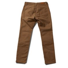 STORY Our flagship pant, the Foundation has been with us since the very beginning. This timeless classic was designed and built to be as ready an option as your favorite pair of jeans; they will no doubt contend for the top position as your go-to pant for daily wear in all conditions. Attention to details and fit, the Foundation is built with function, durability and versatility all in mind. This pant is constructed in our State-side Canvas, a substantial fabric is micro sanded and has a fusion Classic Mid-rise Chinos With Five Pockets, Classic Tapered Leg Work Pants With Patch Pockets, Everyday Straight Leg Chinos With Patch Pockets, Straight Leg Chinos With Patch Pockets, Classic Straight Leg Pants For Everyday, Classic Chino Cotton Twill Bottoms With Patch Pockets, Classic Bottoms With Standard Cut Leg For Fall, Workwear Pants With Five Pockets, Mid-rise Brown Bottoms For Everyday