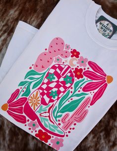 This one is just for you, mama! This beautiful floral boot print pressed onto an Ivory Comfort Colors tee and is sure to be your new favorite tee! These tees are created by A Western Way and have a 3-8 business day turn around time. ⋆ Ivory Comfort Colors Tee⋆ 100% Cotton⋆ Printed in-house using DTF Transfers⋆ Wash instructions will be included Wash Instructions:- Wash inside out- Machine wash COLD- Hang to dry for best results- Do not iron or tumble dry to avoid damaging the design Floral Boots, Boot Print, Printing Press, Comfort Colors Tee, Dtf Transfers, Comfort Colors, Turn Ons, Clothes For Women, Floral