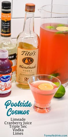 some drinks are sitting on a counter with limes and other ingredients in the background