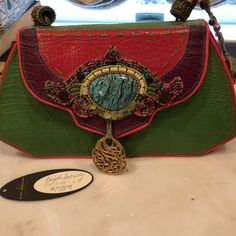 Beautiful Green And Pink Bag Designer Satchel Clutch For Shopping, Designer Green Handheld Bag, Designer Handheld Clutch For Shopping, Pink Top Handle Bag With Magnetic Closure, Luxury Multicolor Crossbody Bag, Designer Multicolor Shoulder Bag For Formal Occasions, Luxury Multicolor Handheld Shoulder Bag, Designer Formal Multicolor Shoulder Bag, Leather Handheld Bag With Magnetic Closure