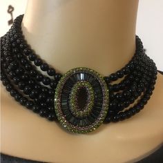 Attractive Heidi Daus Swarovski Crystals Oval Smooth Black Onyx Beads Necklace! 4 Inch Extender Chain With Olivine Crystals. The Oval Center Has An Opening In The Center! Beautiful! Graced With Round Olivine & Light Amethyst Crystals & Montana Blue Baguette Stones In Middle! Antique Gold Brass. Beautiful Choker, Perfect For The Holiday Season! Signature Piece Authentic Heidi Daus Stamped! Never Used, About 22 Years! Beautifully Strung, Only 1 Flaw, 1 Montana Blue Baguette Stone In The Center Pie Elegant Embellished Black Necklace, Elegant Black Embellished Necklace, Beautiful Chokers, Jewelry Illustration, Amethyst Crystals, Heidi Daus, Light Amethyst, Jewelry Lookbook, Onyx Bead