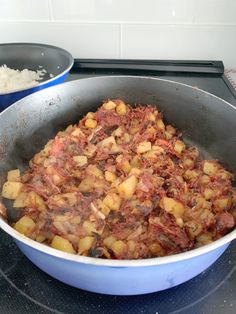 some food is cooking in a pan on the stove