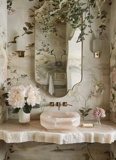 a bathroom with floral wallpaper and mirror