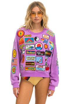 Trendy Patchwork Sweatshirt For Streetwear, Athleisure Long Sleeve Patchwork Sweatshirt, Long Sleeve Patchwork Sweatshirt In Athleisure Style, Streetwear Crew Neck Sweatshirt With Logo Patch, Streetwear Long Sleeve Tops With Embroidered Patch, Graphic Print French Terry Sweatshirt For Loungewear, Long Sleeve Sweatshirt With Embroidered Patch For Streetwear, Trendy Patchwork Crew Neck Sweatshirt, Trendy Purple Sweatshirt With Graphic Print