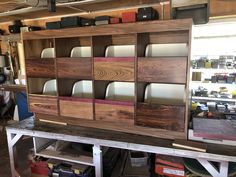 the shelves are made out of wood and have different colors