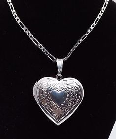 Shiny SILVER Plated Heart Shaped Photo Locket Memory Locket ☆ Measures 1 inch wide by 1 inch high ☆ Made of Stainless steel and then SILVER plated ☆ Opens up for photo insertion. ☆ A FREE Surprise is INSIDE! ☆ Strung on a BRIGHT SILVER plated stainless steel FIGARO chain 2mm wide by 50cm/ 19.7 inches long with lobster clasp. ☆ Valentine Gift ☆ Christmas Gift ☆ Gift For her | Girlfriend gift ☆ Gift for Mom ☆ Ready to ship! ☆ Free Jewelry gift box and reusable gift bag are included for easy giftin Silver Figaro Chain, Leg Art, Accessories Necklaces, Valentine Gift For Wife, Large Pendant Necklace, Memory Locket, Girly Bags, Jewelry Accessories Ideas, Dope Jewelry