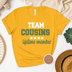 This adorable Team Cousin shirt is perfect for family reunions, gatherings, or just celebrating your bond with your cousins! Made from soft, high-quality material, this shirt is comfortable to wear all day long. Show your cousin love and unity with this stylish and fun design. Available in a variety of sizes and colors, so you can coordinate with your favorite cousins! This shirt makes a great gift to strengthen your family ties. Shop these cool Cousin Shirts today. All shirts are unisex and ava Casual Graphic Print Shirt For Family Gatherings, Casual Pre-shrunk T-shirt For Family Events, Casual T-shirt With Text Print For Family Reunion, Casual Relaxed Fit Tops For Family Reunion, Casual Relaxed Fit Tops For Family Gatherings, Family Matching Tops With Letter Print For Gatherings, Crew Neck Shirt With Letter Print For Family Gatherings, Casual Letter Print Shirt For Family Reunion, Family Matching Crew Neck Shirts For Gatherings