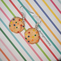 Candy Cookie Earrings Cookies measure approximately between 1.5cm to 2.25cm Materials: ▫ Polymer Clay ▫ Hypoallergenic Hanging Earring Hook Each Cookie is handmade by me, so you may receive a pair of earrings that are slightly different from the ones pictured in the listing. As they are all made by hand all are similar but no two pairs will ever be the same! I can also do custom orders. Please feel free to send me a message with any questions or ideas! Thanks for checking out my shop! Nickel-free Multicolor Earrings For Birthday, Multicolor Round Earrings For Birthday, Nickel Free Novelty Earrings For Everyday Wear, Handmade Round Earrings For Birthday, Playful Handmade Round Earrings, Cute Multicolor Round Earrings, Playful Round Hypoallergenic Earrings, Playful Hypoallergenic Round Earrings, Playful Nickel-free Drop Earrings