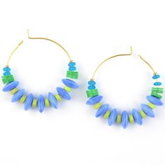 Made in the USA Brass hoops Kelly green, aqua and blue beads Earrings hang 1.5 inches Want to see more of this collection? David Aubrey lines vary from delicate, meticulously assembled jewelry of monochromatic hues to larger, more vibrant pieces. Some collections are themed, whether romantic, vintage, tribal, or art deco. Each piece is painstakingly crafted with an array of raw materials, including plated and oxidized brass and white metal, semiprecious stones, vintage glass beads, Indian handma Blue Beaded Small Hoop Jewelry, Handmade Blue Hoop Jewelry, Blue Small Hoop Beaded Earrings With Dangling Beads, Blue Round Beaded Earrings With Spacer Beads, Blue Round Bead Hoop Earrings Gift, Blue Hoop Earrings With Round Beads As Gift, Blue Small Hoop Jewelry With Dangling Beads, Small Hoop Earrings With Colorful Beads In Blue, Blue Small Hoop Earrings With Dangling Beads