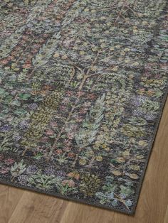 an area rug with flowers and leaves on it