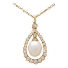 A fabulous cultured pearl and diamond garland pendant necklace set in 18k yellow gold. The pendant prominently features a 6 x 8-millimetre pearl that elegantly hangs within a circular diamond set garland motif. To the top of the pearl is a single round brilliant cut diamond and the garland hangs from a rub over set diamond on a plain bail. The pendant come with a 16-18-inch yellow gold trace chain secured with a lobster clasp fitting. Due to the design and size this piece would be ideal for a va Yellow Diamond Necklace, Gold Garland, Modern Necklaces, Women Diamond, Pearl Diamond, Diamond Set, Modern Pendant, Yellow Diamond, Round Brilliant Cut Diamond